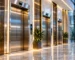 Modernized stainless steel elevators in a marble-clad building lobby