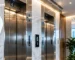 Two stainless steel elevators in a marble lobby, elevator modernization in Lebanon by Ecolift